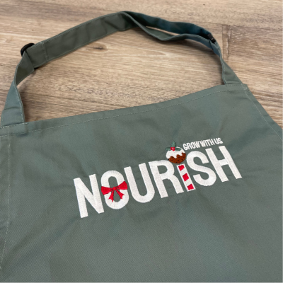 Nourish embroidered logo in a festive theme