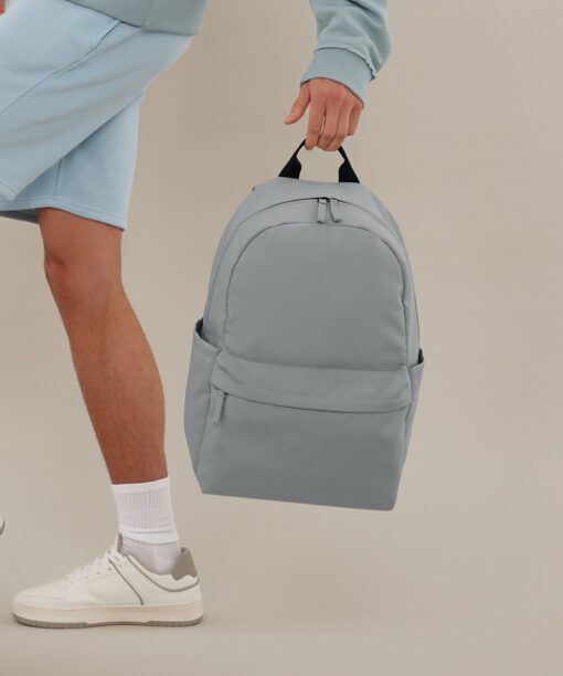 A man holding a backpack